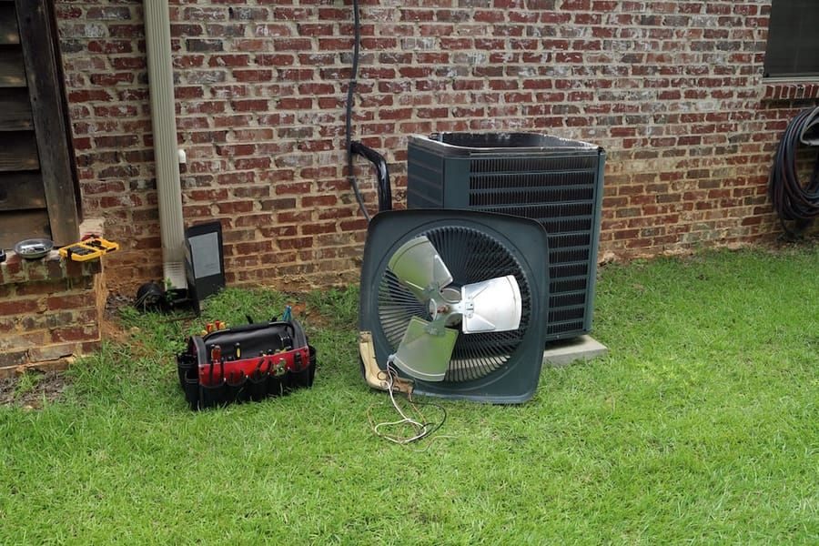 AC maintenance service in Madison and Greater Wisconsin with technician performing system tune-up.