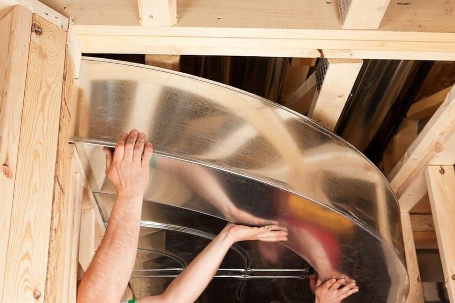 AC repair in Madison and Greater Wisconsin fixing residential air conditioning system ductwork.