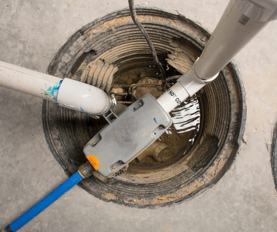 Sump pump in the basement of a home to prevent flooding